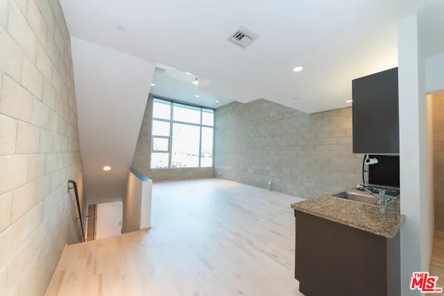 a view of a kitchen cabinets and a wooden floor