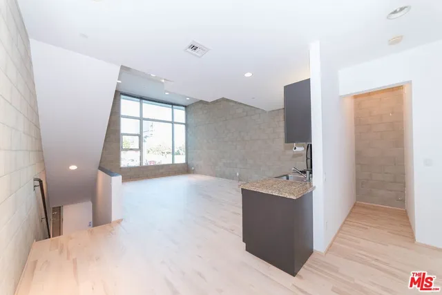 a bathroom with a bathtub sink and mirror