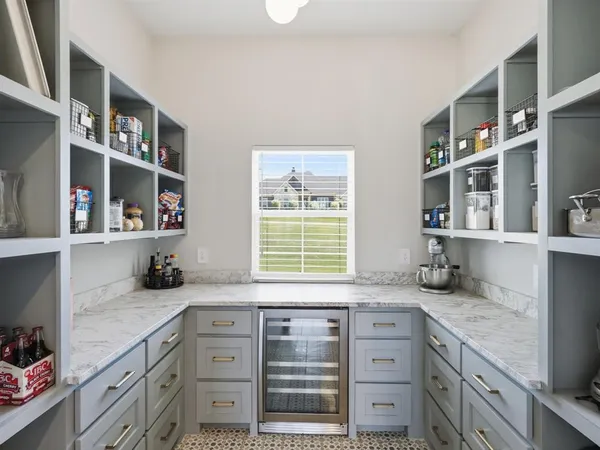 a view of a livingroom with furniture window and a ceiling fan