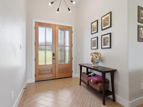 a kitchen with stainless steel appliances granite countertop counter space a sink refrigerator and cabinets