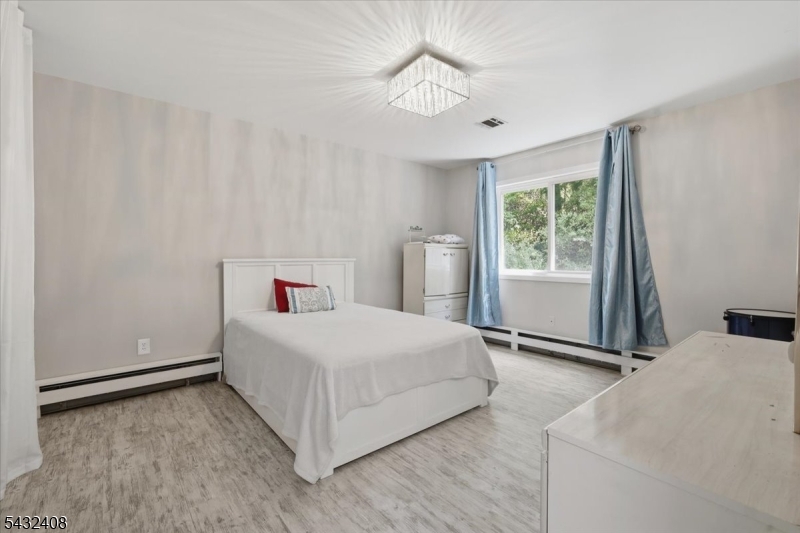 112 Knob Hill Road Hackettstown, NJ 07840 - Photo 26 of 32 a bedroom with a bed and a window