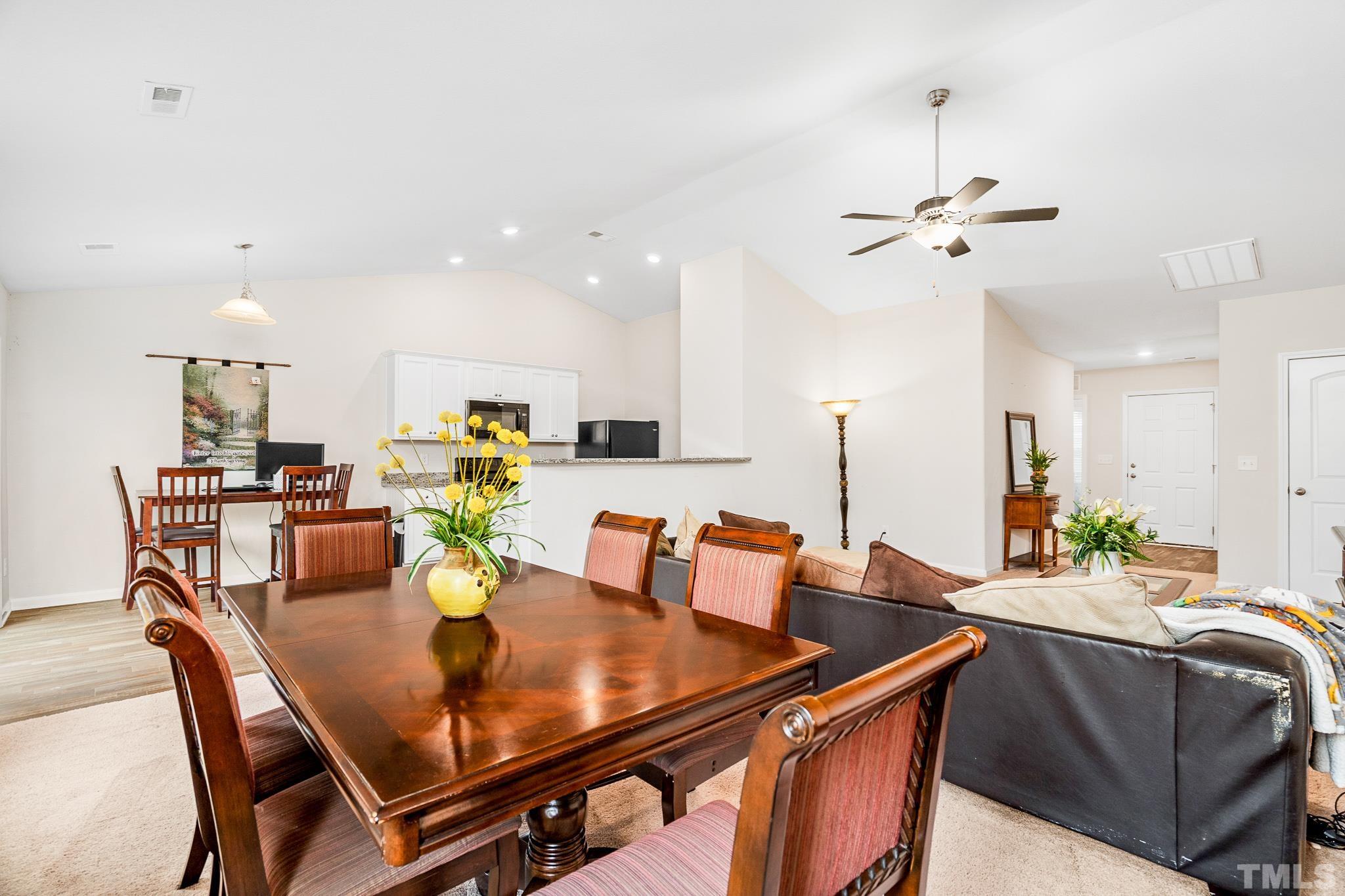 244 Rustling Way Zebulon, NC 27597 - Photo 8 of 25 a view of a dining room with furniture