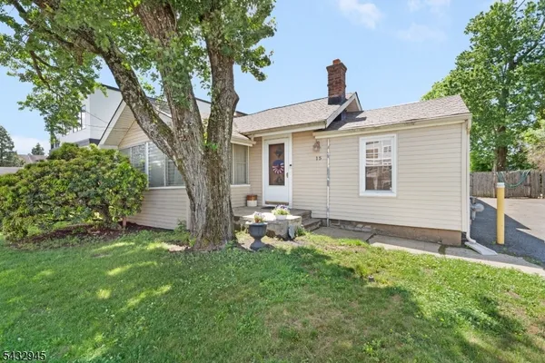 a view of a house with a back yard