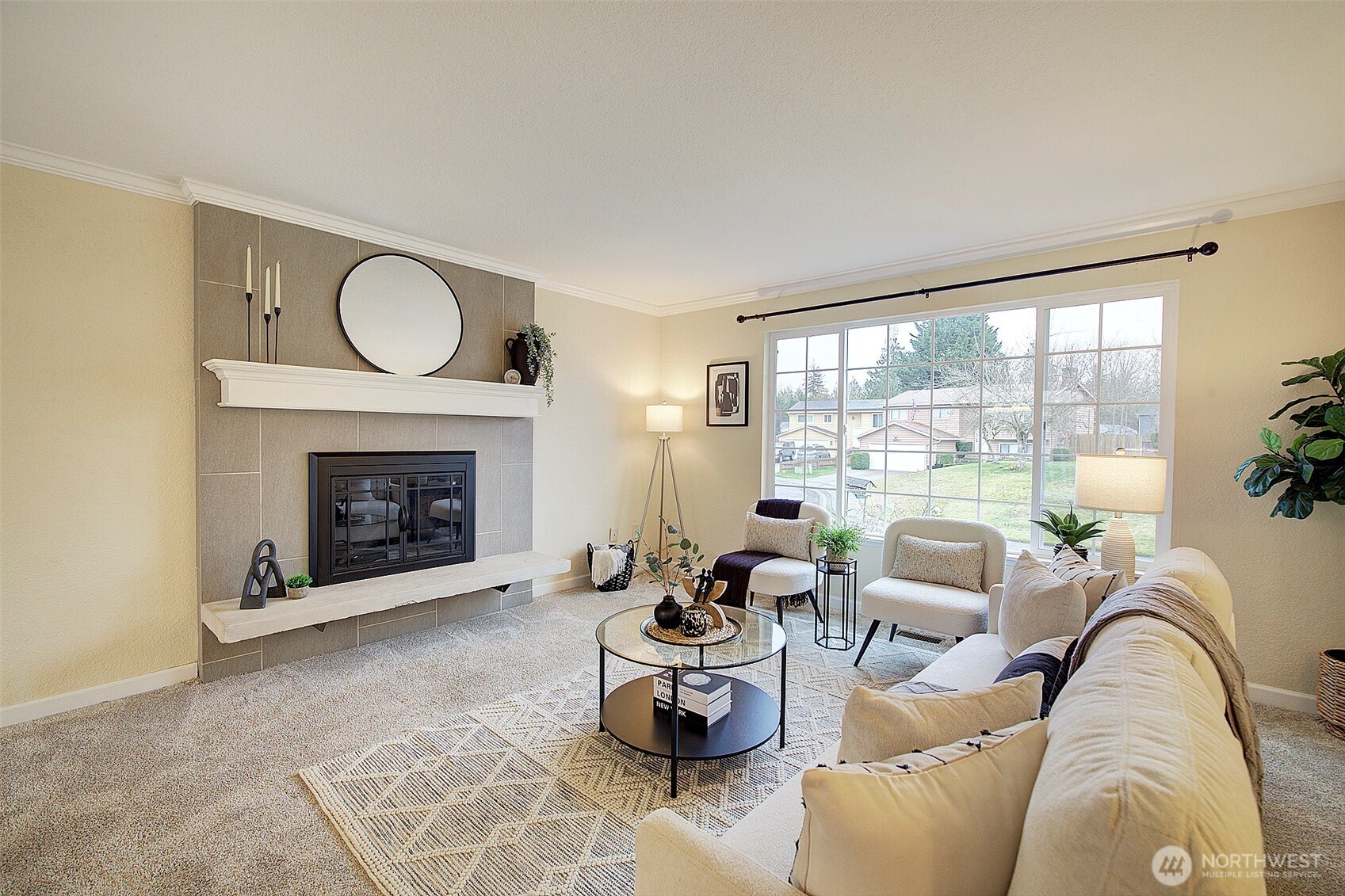 26229 197th Place Southeast Covington, WA 98042 - Photo 2 of 39 a living room with furniture potted plant and a fireplace