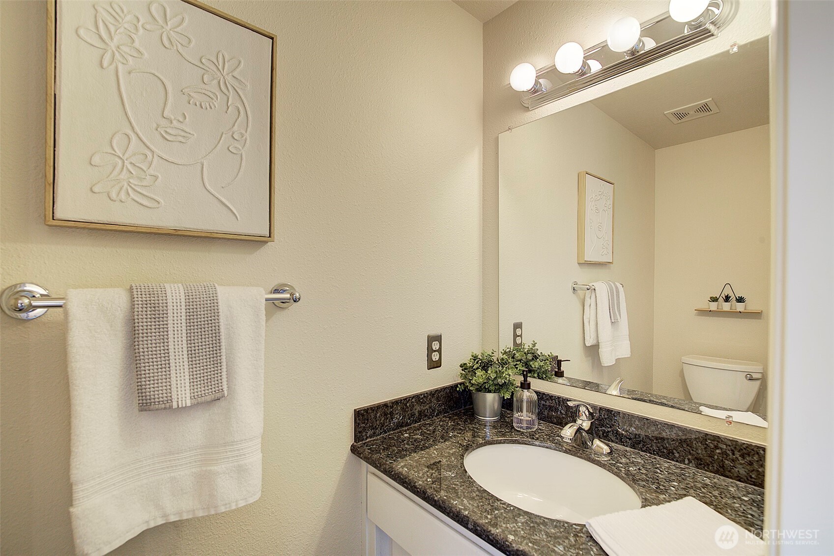 26229 197th Place Southeast Covington, WA 98042 - Photo 21 of 39 a bathroom with a granite countertop sink a mirror and a shower