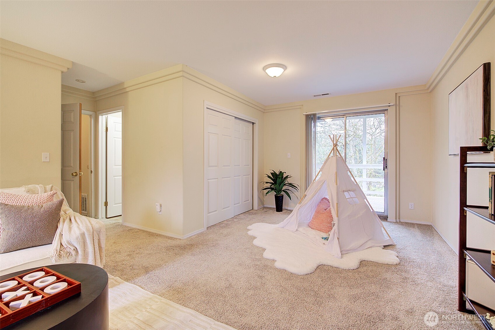 26229 197th Place Southeast Covington, WA 98042 - Photo 28 of 39 a living room with furniture and a window