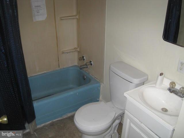 3319 Bero Road Halethorpe, MD 21227 - Photo 5 of 7 a white toilet sitting next to a bath tub