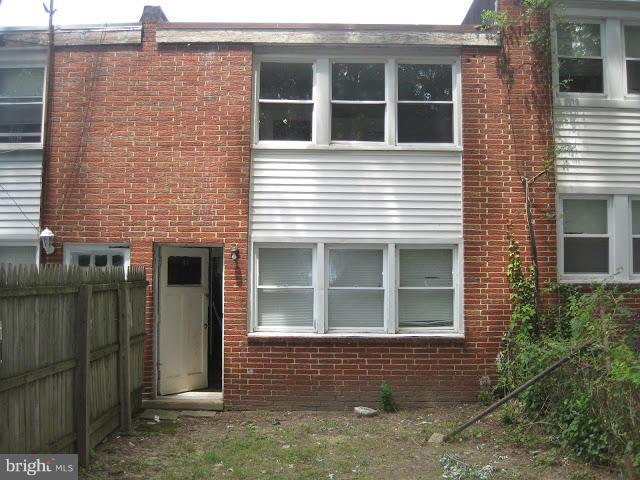 3319 Bero Road Halethorpe, MD 21227 - Photo 7 of 7 a view of a brick house with large windows