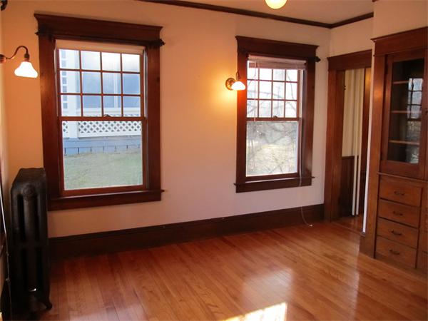 22 St Elmo Road Worcester, MA 01602 - Photo 3 of 20 an empty room with wooden floor and windows