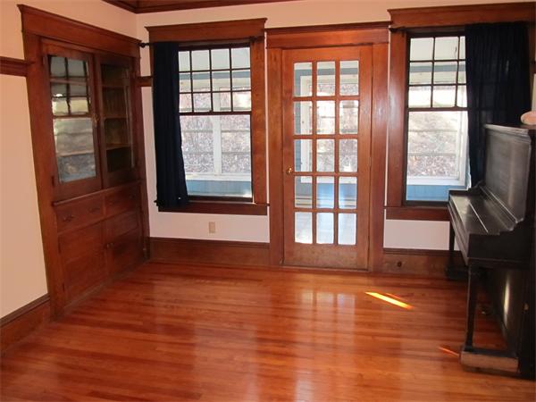 22 St Elmo Road Worcester, MA 01602 - Photo 8 of 20 a view of empty room with wooden floor and fan