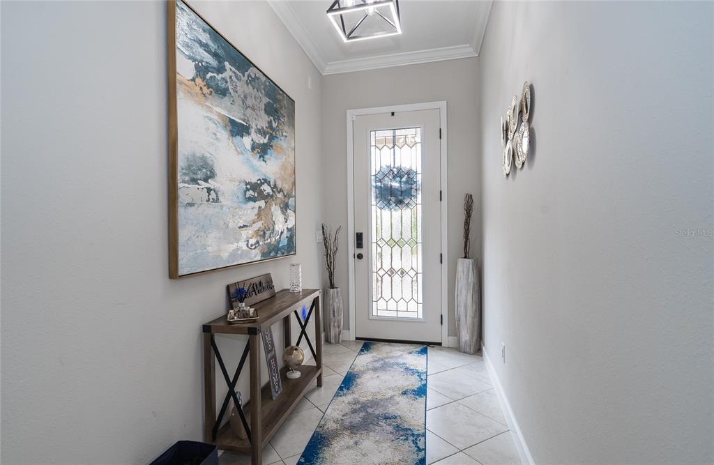 8099 Lago Mist Way Wesley Chapel, FL 33545 - Photo 11 of 56 a view of a hallway with windows