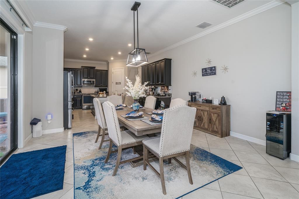 8099 Lago Mist Way Wesley Chapel, FL 33545 - Photo 16 of 56 a view of a dining room with furniture