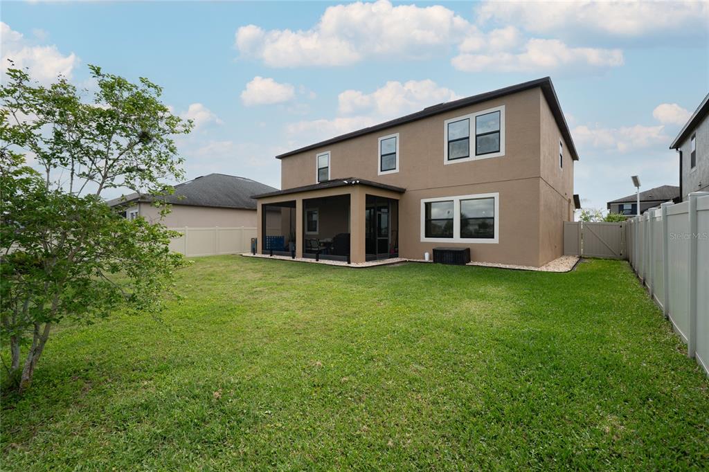 8099 Lago Mist Way Wesley Chapel, FL 33545 - Photo 2 of 56 a front view of house with yard and green space
