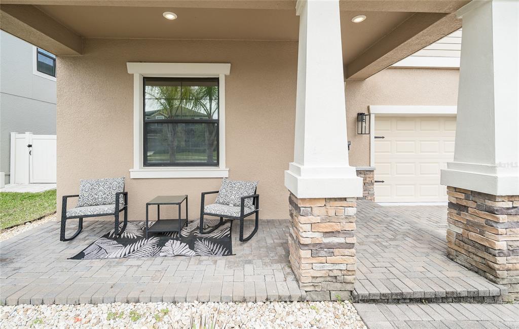 8099 Lago Mist Way Wesley Chapel, FL 33545 - Photo 10 of 56 a living room with furniture and a table