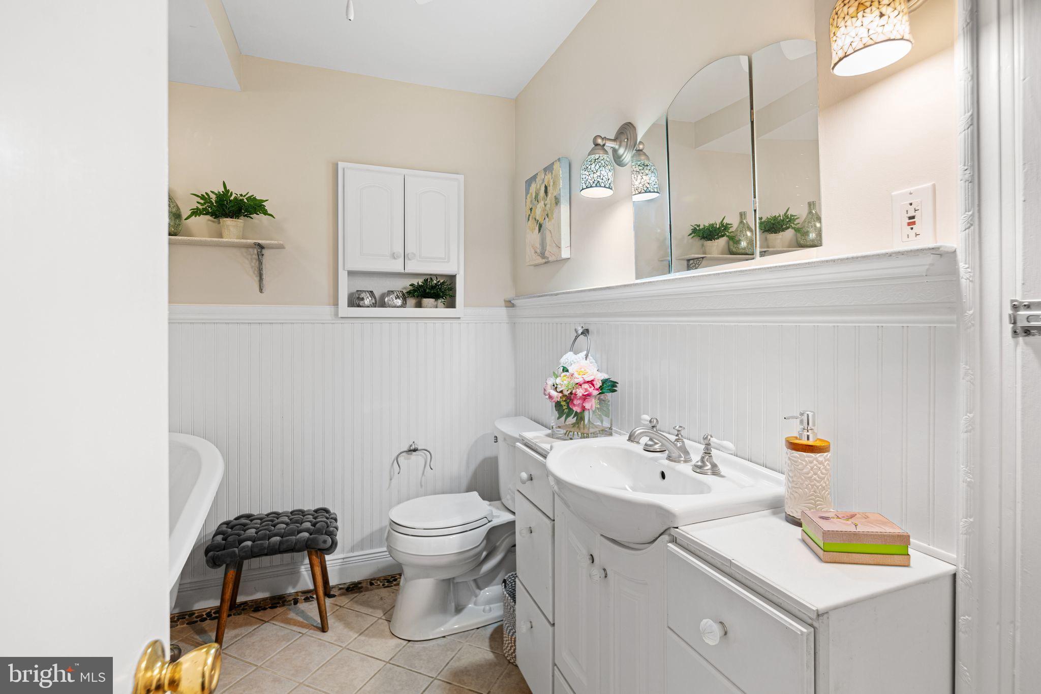 435 1st Avenue Haddon Heights, NJ 08035 - Photo 12 of 19 a bathroom with a sink toilet and mirror