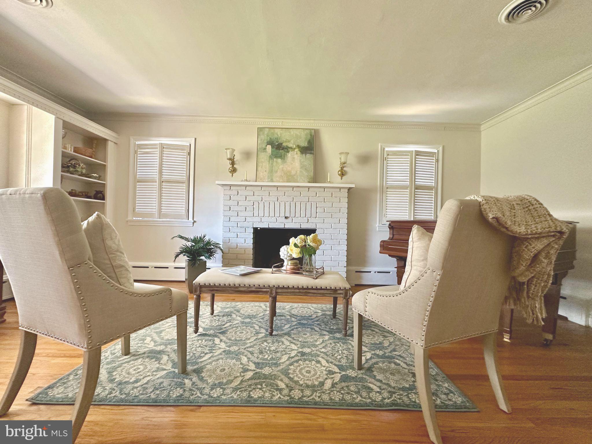 435 1st Avenue Haddon Heights, NJ 08035 - Photo 3 of 19 a living room with furniture and a fireplace