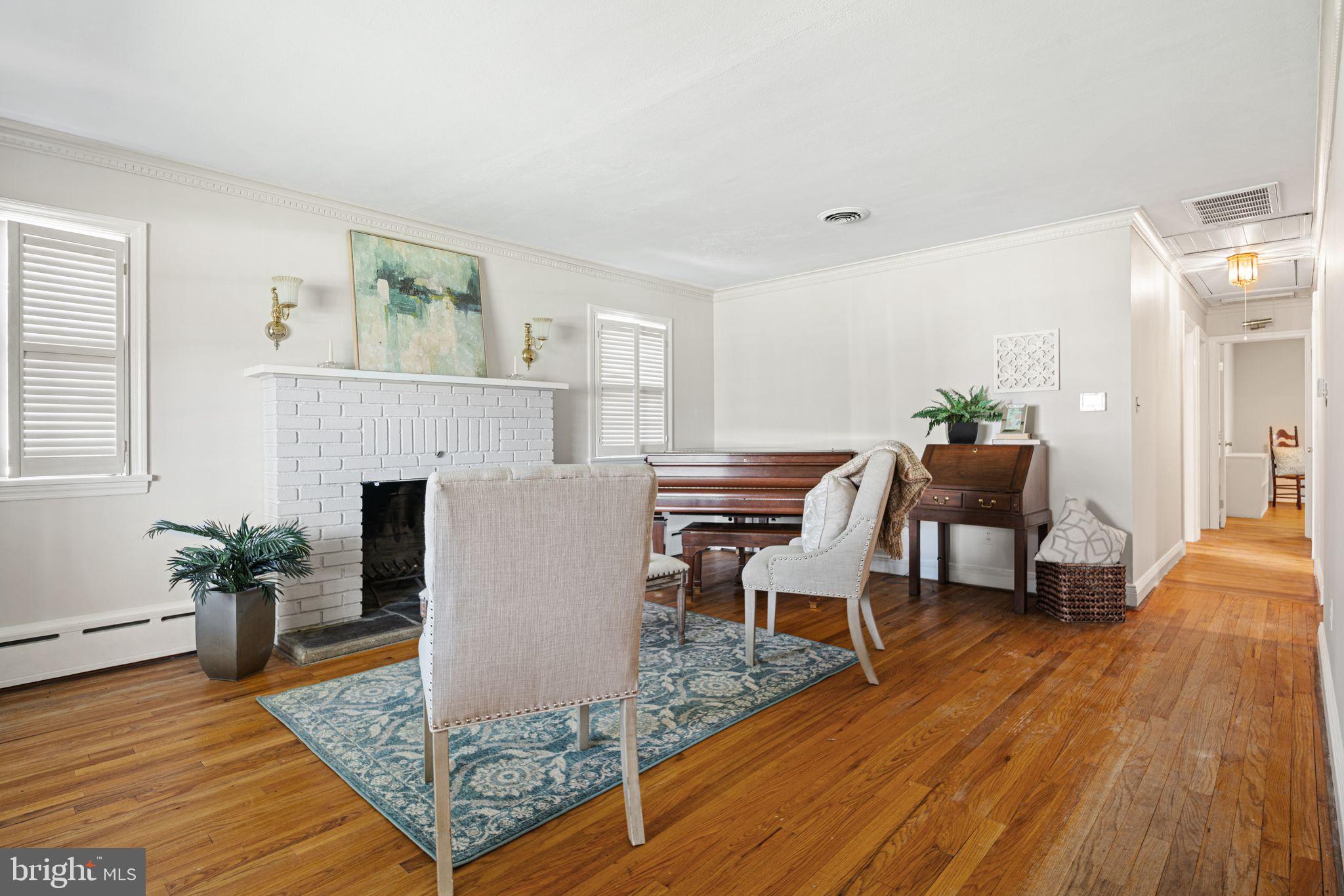 435 1st Avenue Haddon Heights, NJ 08035 - Photo 4 of 19 a living room with furniture and a fireplace