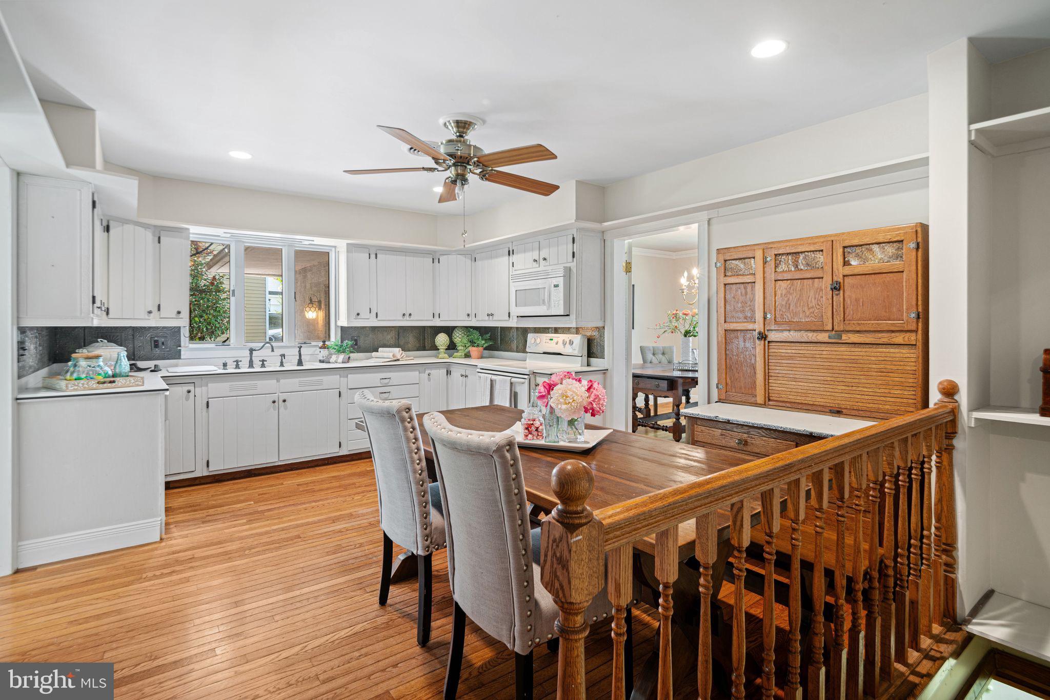 435 1st Avenue Haddon Heights, NJ 08035 - Photo 6 of 19 a kitchen with stainless steel appliances granite countertop a dining table chairs refrigerator a sink and cabinets