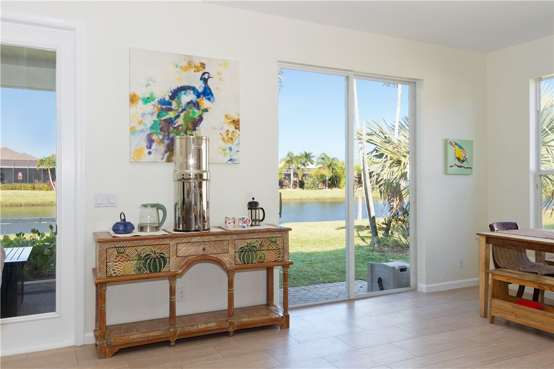 628 Tangelo Circle Southwest Vero Beach, FL 32968 - Photo 13 of 36 a living room with furniture and a potted plant