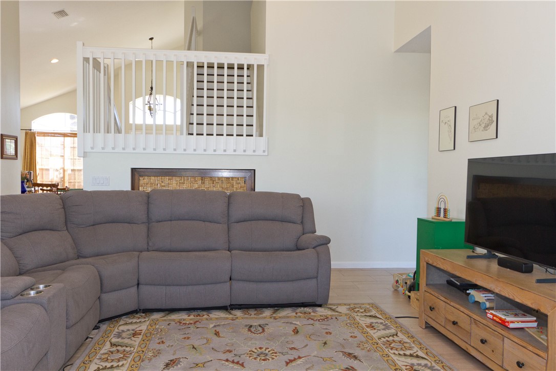 628 Tangelo Circle Southwest Vero Beach, FL 32968 - Photo 15 of 36 a living room with furniture and a flat screen tv