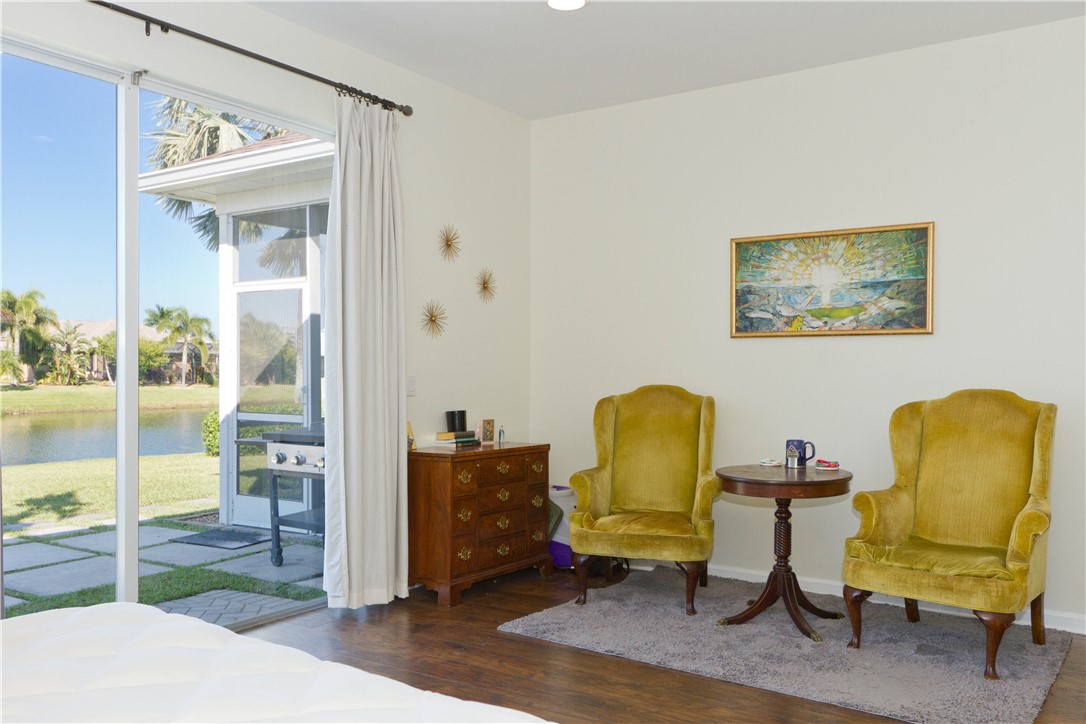 628 Tangelo Circle Southwest Vero Beach, FL 32968 - Photo 17 of 36 a view of a workspace with furniture and a window