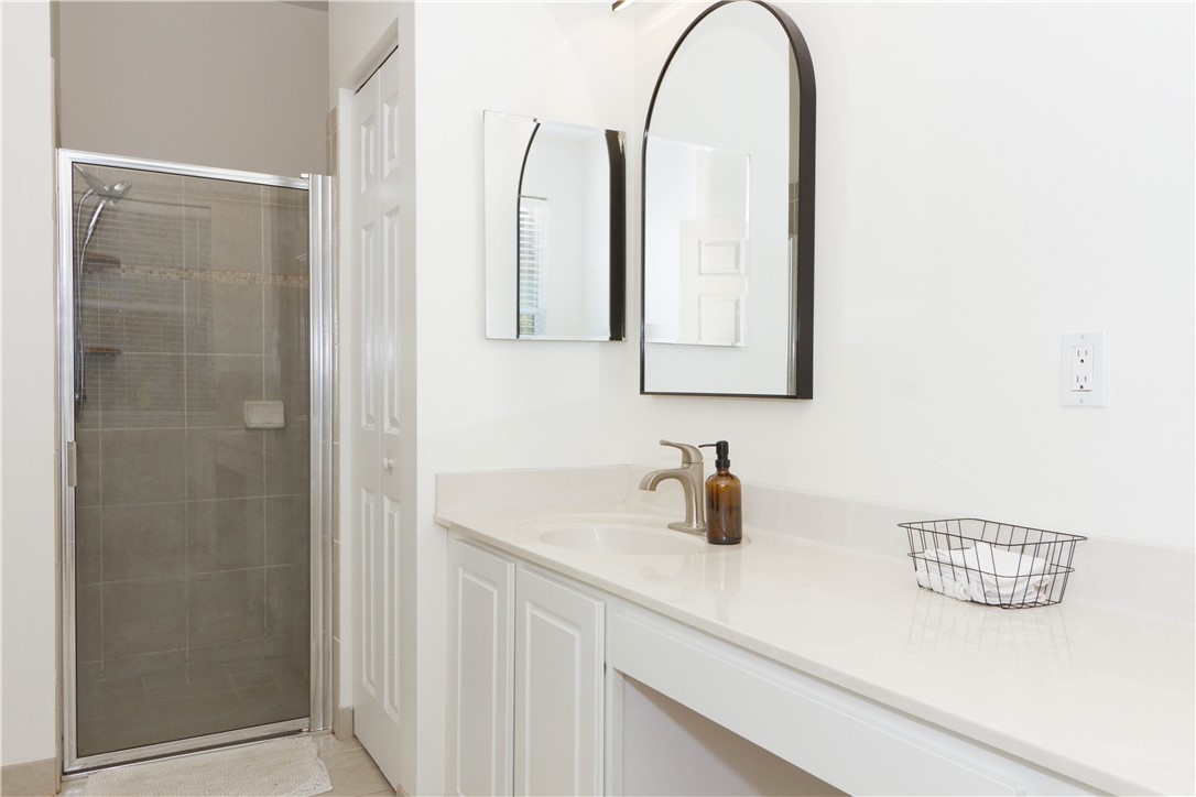 628 Tangelo Circle Southwest Vero Beach, FL 32968 - Photo 19 of 36 a bathroom with a sink and a mirror