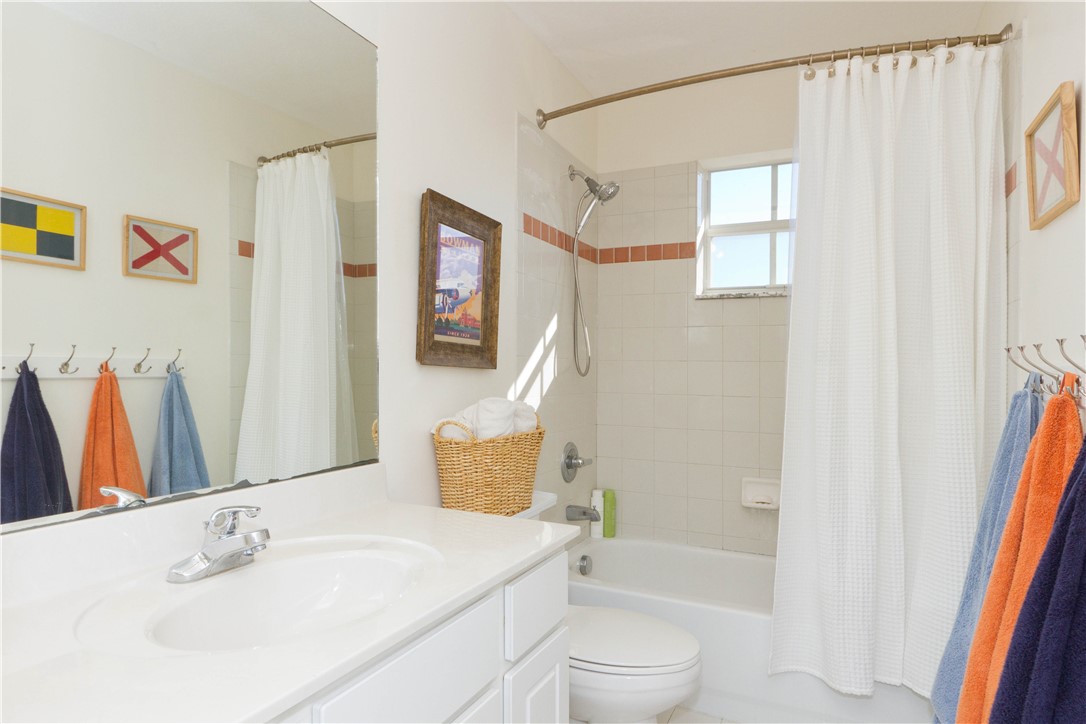 628 Tangelo Circle Southwest Vero Beach, FL 32968 - Photo 22 of 36 a bathroom with a sink toilet and shower