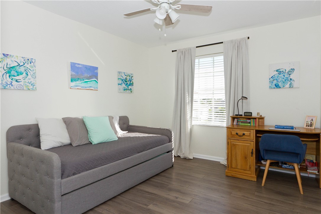 628 Tangelo Circle Southwest Vero Beach, FL 32968 - Photo 24 of 36 a living room with furniture and a wooden floor