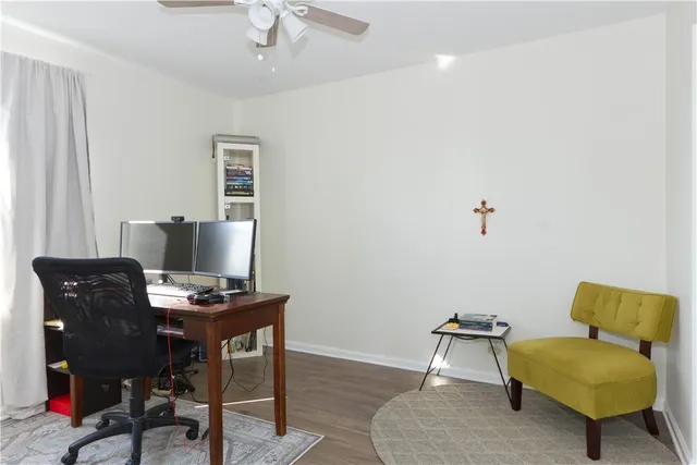 a view of a workspace with furniture