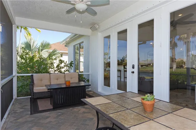a outdoor dining space with furniture and a garden