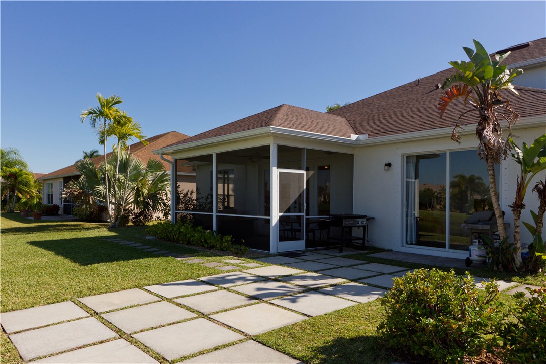 628 Tangelo Circle Southwest Vero Beach, FL 32968 - Photo 27 of 36 a front view of a house with a garden