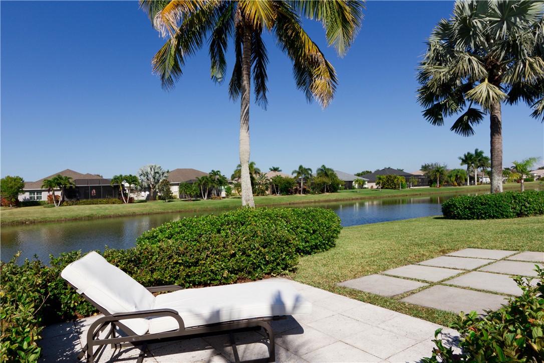 628 Tangelo Circle Southwest Vero Beach, FL 32968 - Photo 5 of 36 a view of a garden with a table and chairs