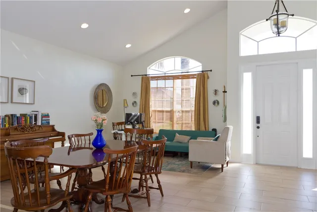 a view of a dining room with furniture and a window