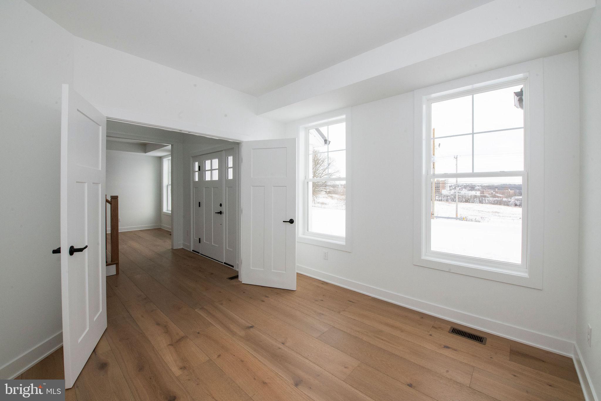 209 Old State Road Royersford, PA 19468 - Photo 14 of 29 an empty room with wooden floor and a window