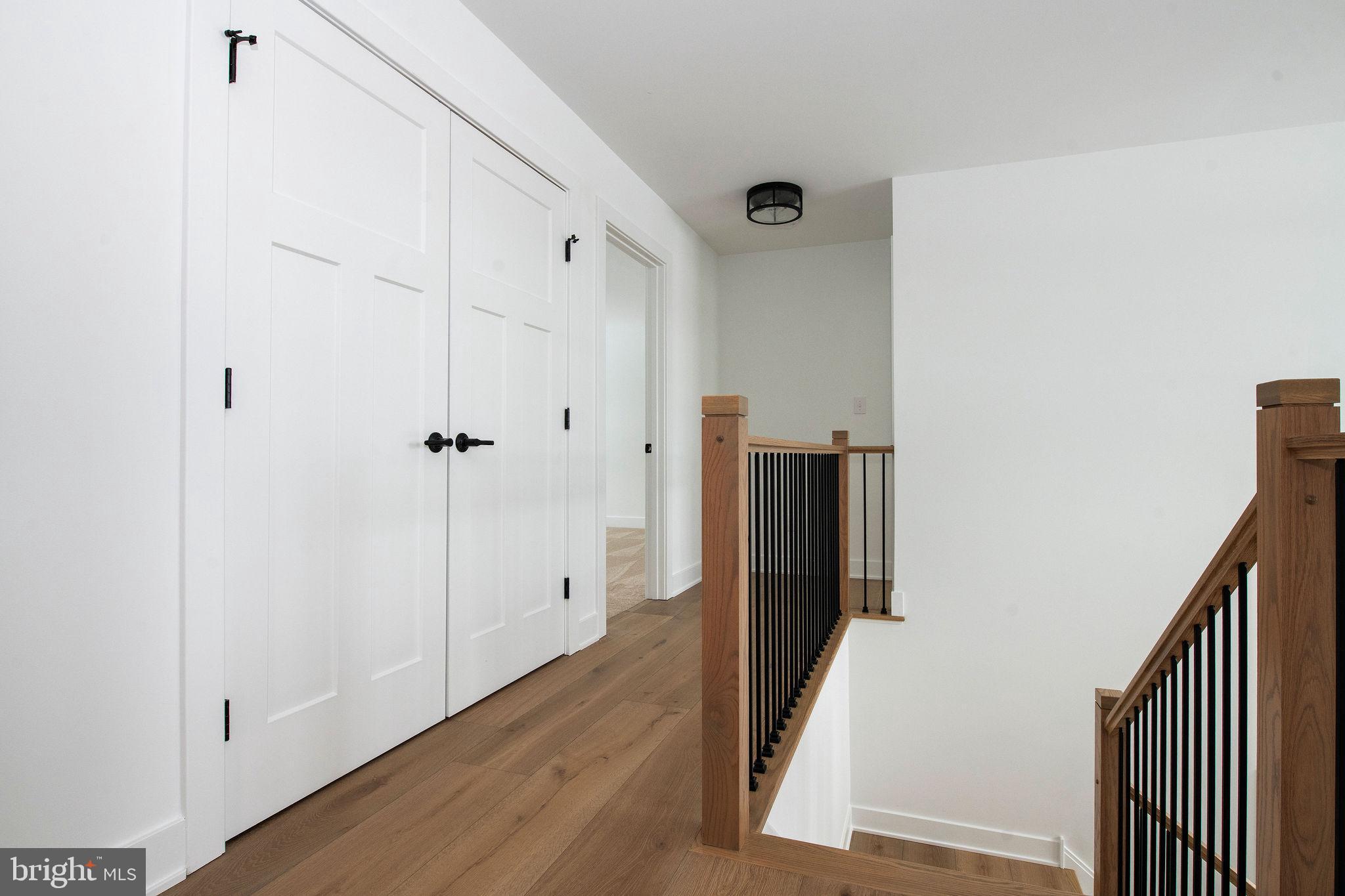 209 Old State Road Royersford, PA 19468 - Photo 16 of 29 a view of a hallway with wooden floor and staircase