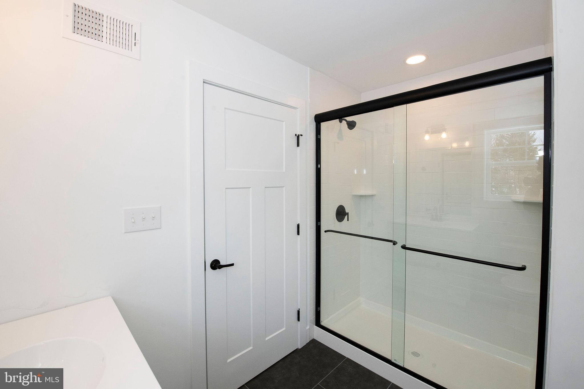 209 Old State Road Royersford, PA 19468 - Photo 29 of 29 a bathroom with a glass shower door