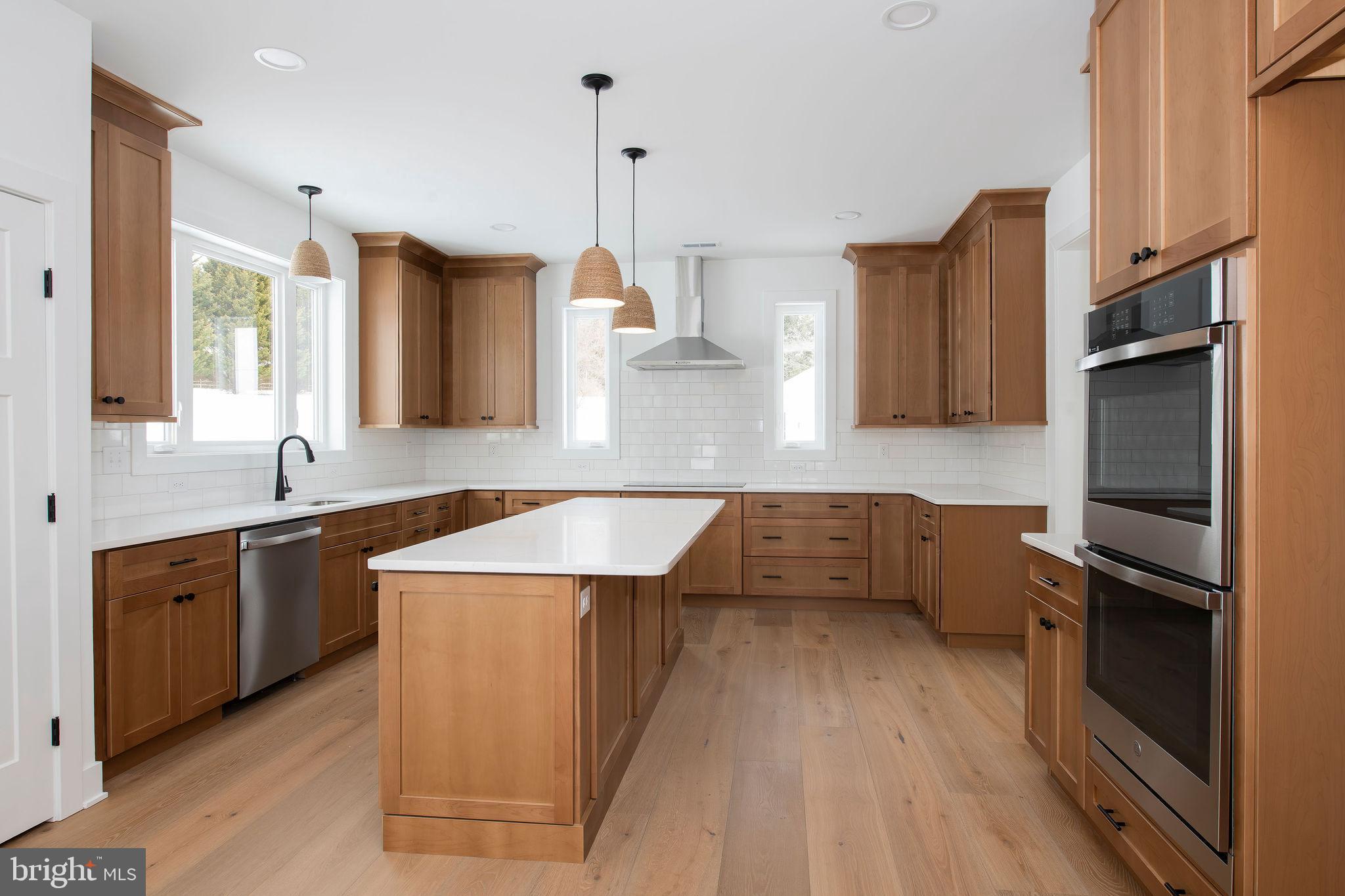 209 Old State Road Royersford, PA 19468 - Photo 3 of 29 a kitchen with stainless steel appliances granite countertop a sink a stove and a refrigerator