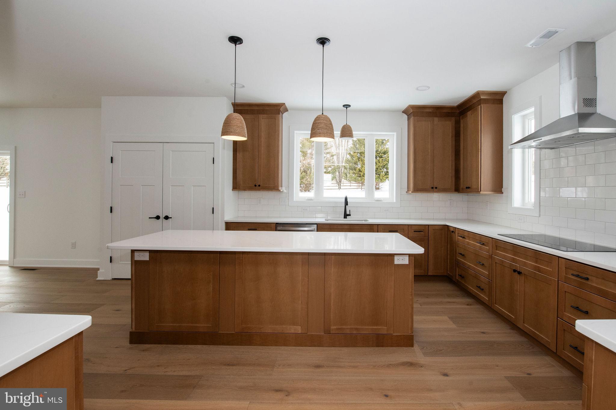 209 Old State Road Royersford, PA 19468 - Photo 4 of 29 a kitchen with stainless steel appliances granite countertop a sink a microwave oven and a white cabinets