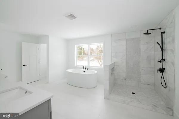 a bathroom with a sink a mirror and a toilet