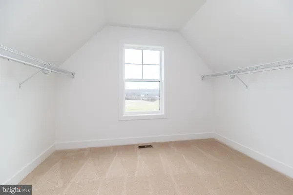 a view of a room with wooden walls