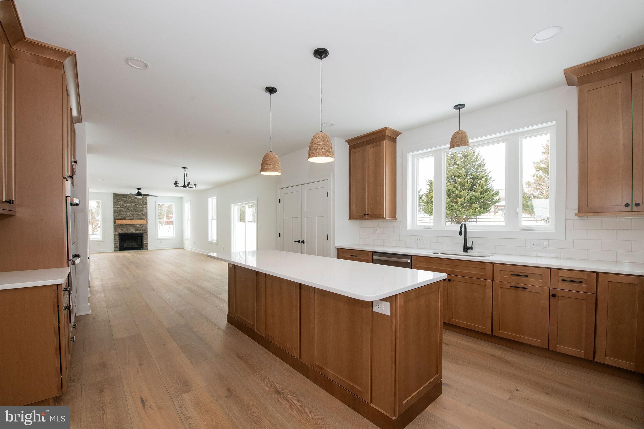 209 Old State Road Royersford, PA 19468 - Photo 7 of 29 a large kitchen with kitchen island a sink appliances wooden floor and a window
