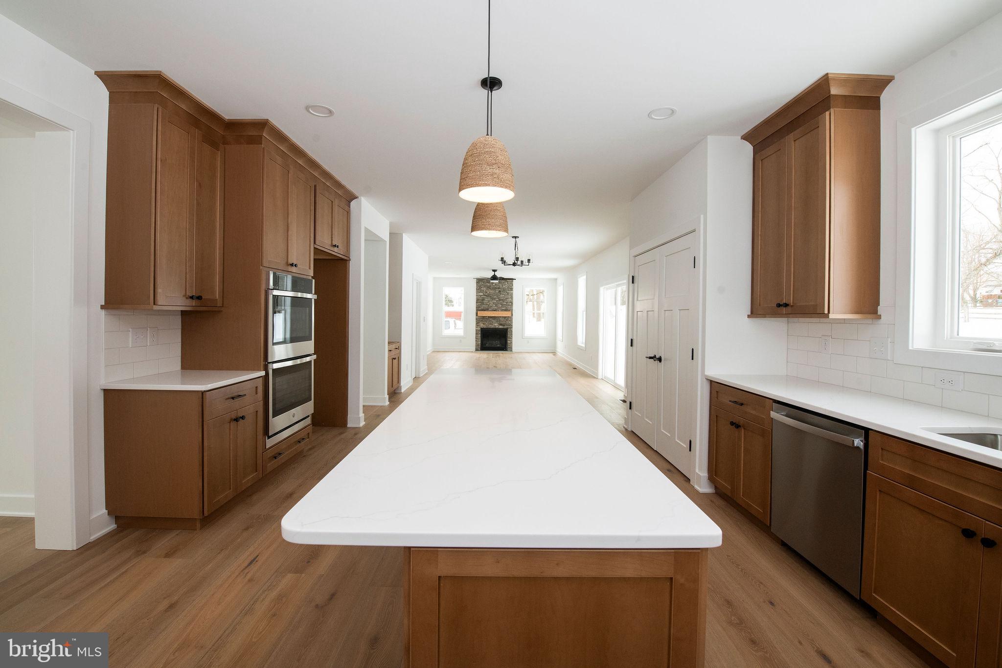 209 Old State Road Royersford, PA 19468 - Photo 8 of 29 a large kitchen with cabinets wooden floor and stainless steel appliances