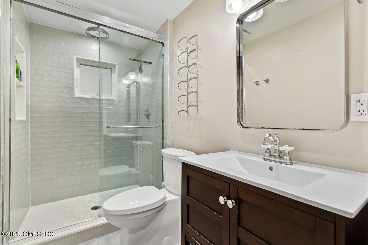 207 Sheep Hill Road Riverside, CT 06878 - Photo 14 of 18 a bathroom with a sink a toilet and shower