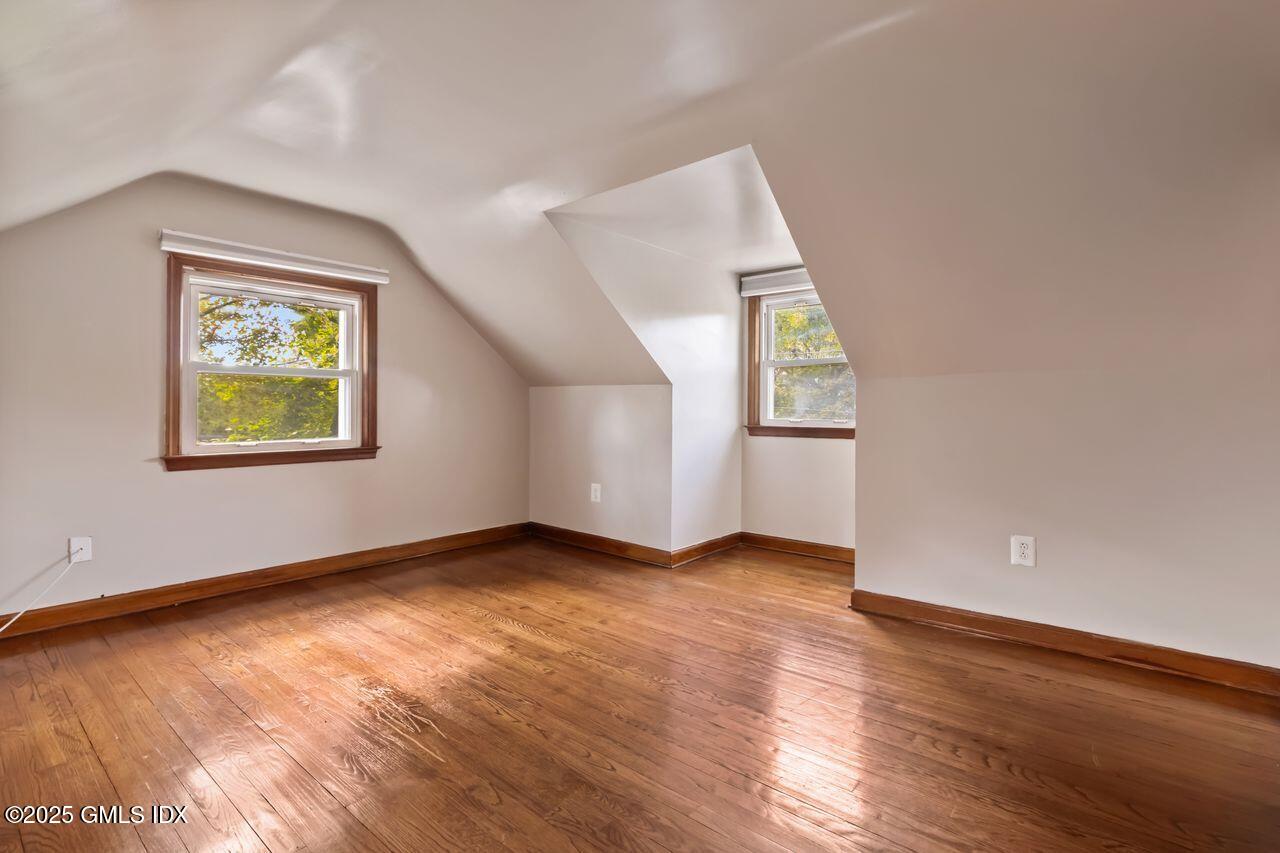 207 Sheep Hill Road Riverside, CT 06878 - Photo 15 of 18 an empty room with wooden floor and windows