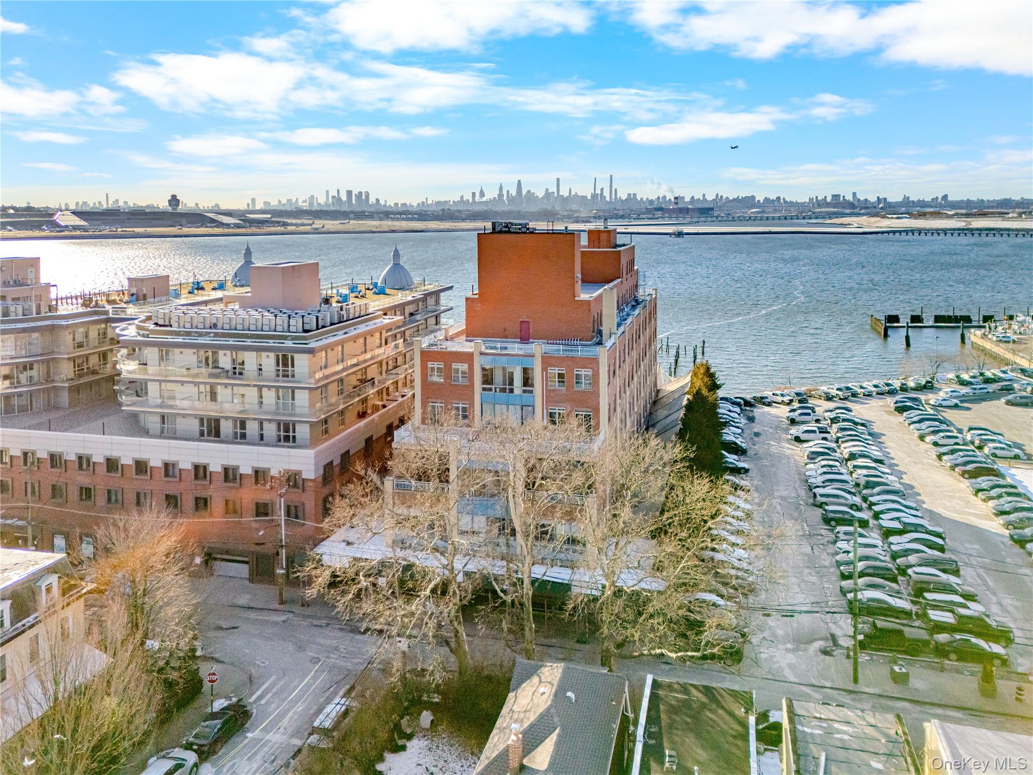 14-34 110th Street, Unit 5I Queens, NY 11356 - Photo 15 of 17 a view of building with outdoor space and ocean view