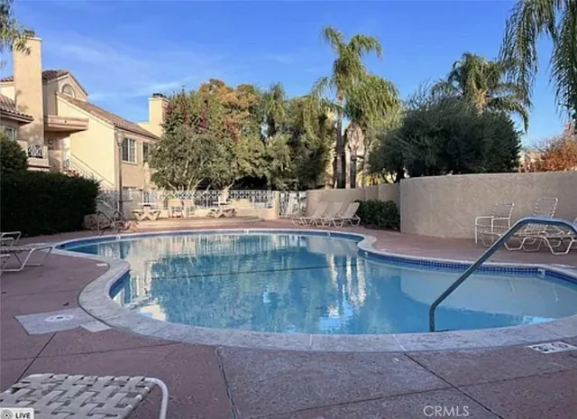 a view of a water fountain in front of a building