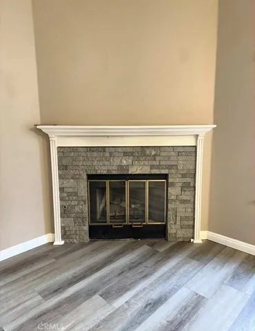 an empty room with a fireplace