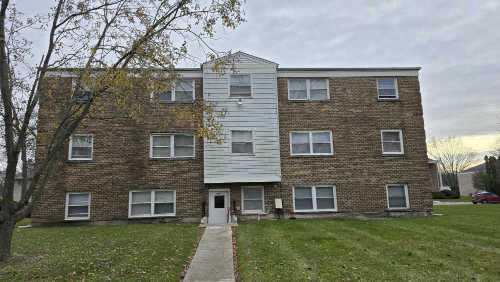 4052 Charleston Road Matteson, IL 60443 - Photo 2 of 10 a brick house that has a lots of windows in it
