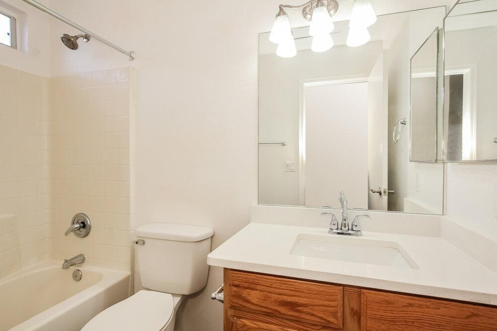 9243 West St John Road Peoria, AZ 85382 - Photo 15 of 17 a bathroom with a sink a toilet and shower