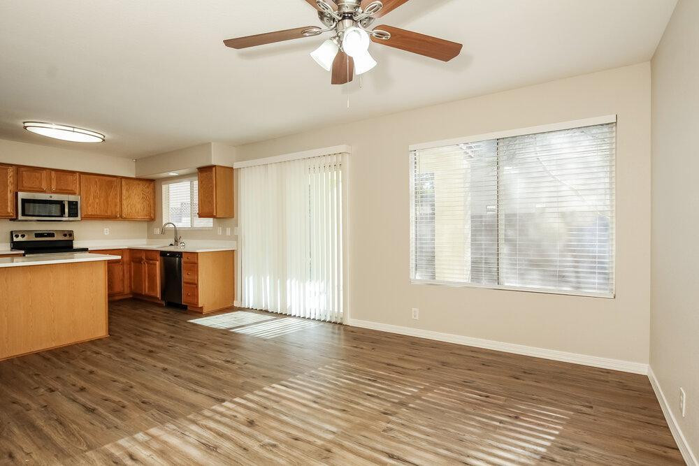 9243 West St John Road Peoria, AZ 85382 - Photo 7 of 17 a view of kitchen with sink microwave and stove
